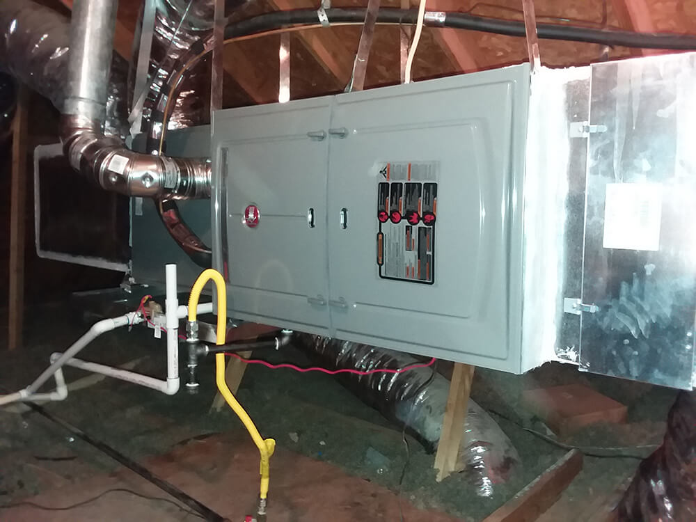 Photo of an interior AC unit in an attic