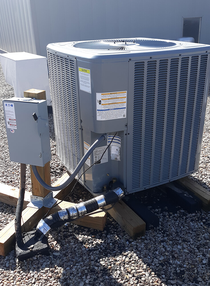 Photo of an AC unit on a roof