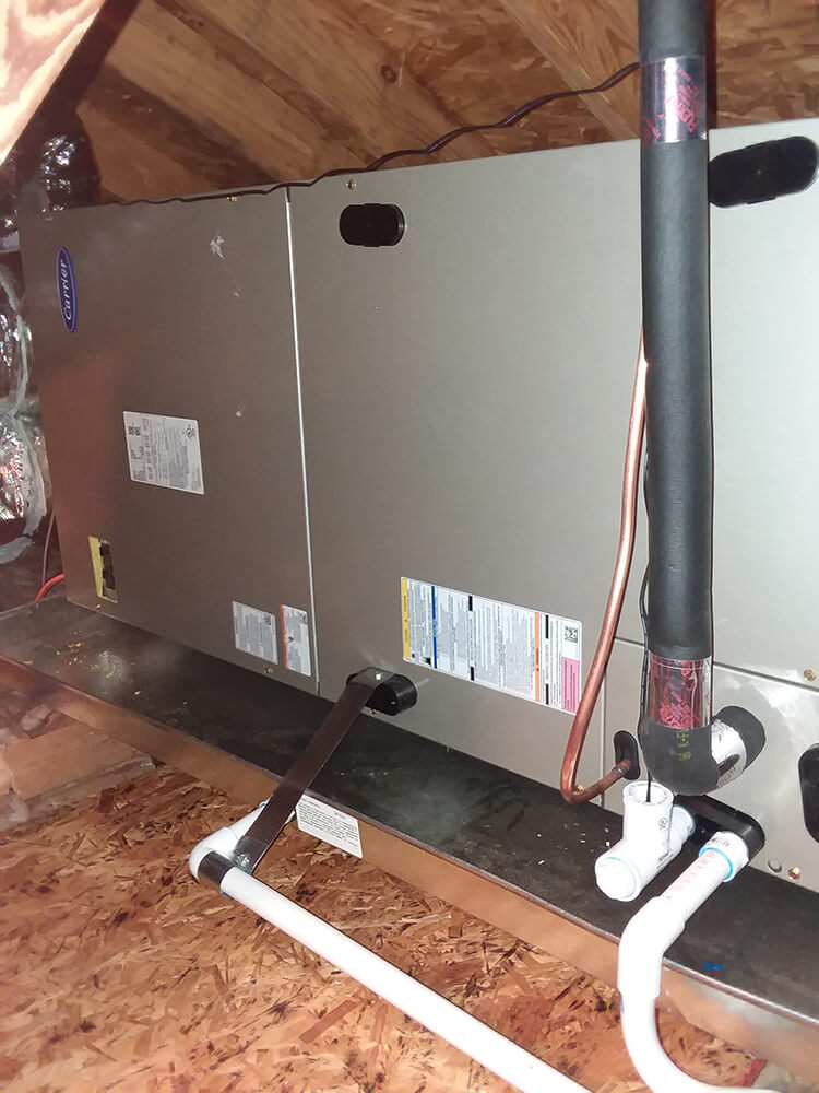 Photo of an interior AC unit in an attic